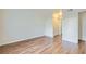 Bedroom with wood-look flooring, neutral paint, and large closet at 5000 Red Rock St # 105, Las Vegas, NV 89118