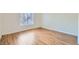 Bright bedroom featuring wood flooring, base trim and a window at 5000 Red Rock St # 105, Las Vegas, NV 89118