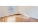 Well-lit bedroom with wood-look floors and a window with modern blinds at 5000 Red Rock St # 105, Las Vegas, NV 89118