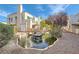 View of beautiful Laguna Del Rey grounds featuring garden landscaping, rock fountain, and building exteriors at 5000 Red Rock St # 105, Las Vegas, NV 89118