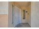 A bright, covered entrance to the condo with a white door and a small window at 5000 Red Rock St # 105, Las Vegas, NV 89118