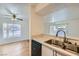The kitchen features stainless steel appliances, tile floors, and bright lighting at 5000 Red Rock St # 105, Las Vegas, NV 89118