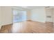 Spacious living room featuring wood flooring and sliding glass doors to the backyard at 5000 Red Rock St # 105, Las Vegas, NV 89118