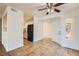 Open living space with tile flooring and a view of the kitchen featuring black appliances at 5000 Red Rock St # 105, Las Vegas, NV 89118