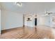Open-concept living area with tile, wood flooring, and a view of the kitchen at 5000 Red Rock St # 105, Las Vegas, NV 89118
