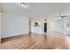 Spacious living room featuring wood floors and an open layout, connecting the living area with the kitchen at 5000 Red Rock St # 105, Las Vegas, NV 89118