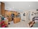 Charming kitchen featuring wood cabinets, stainless steel appliances, and tile flooring at 5009 Rustic Charm Ct, Las Vegas, NV 89131