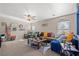 Comfortable living room with plush seating, cozy decor, and natural light from the windows at 5009 Rustic Charm Ct, Las Vegas, NV 89131