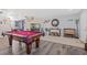 Spacious living room featuring a pool table, with views to the entryway at 5009 Rustic Charm Ct, Las Vegas, NV 89131