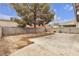 Spacious backyard featuring a mature shade tree and privacy block wall at 5439 Pomeroy Cir, Las Vegas, NV 89142