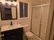 Modern bathroom features a sleek vanity with a mirror and glass-enclosed shower at 5439 Pomeroy Cir, Las Vegas, NV 89142