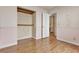 Bedroom features wood laminate flooring, pastel walls, and a closet at 5439 Pomeroy Cir, Las Vegas, NV 89142