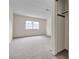 Spacious bedroom with a large window and closet, featuring neutral carpeting at 5439 Pomeroy Cir, Las Vegas, NV 89142
