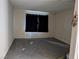 Neutral bedroom with plush carpeting, natural light from the covered window, and a calm and minimalist design at 5439 Pomeroy Cir, Las Vegas, NV 89142