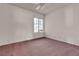 Bedroom with pink carpet, ceiling fan and a large window at 5439 Pomeroy Cir, Las Vegas, NV 89142