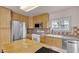 Bright kitchen featuring stainless steel appliances and light wood cabinetry and a center island at 5439 Pomeroy Cir, Las Vegas, NV 89142