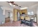 View of the kitchen with stainless steel appliances, oak cabinets, and an island with barstool seating at 5439 Pomeroy Cir, Las Vegas, NV 89142