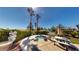 Inviting backyard oasis with a sunken spa, lush landscaping, and outdoor seating area at 5449 Bugle Way # 102, Las Vegas, NV 89108