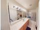 Well-lit bathroom with a single sink vanity, tiled countertops, and shower-tub combo at 5449 Bugle Way # 102, Las Vegas, NV 89108