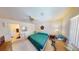 Bright bedroom space featuring ensuite bathroom, ceiling fan and ample lighting at 5449 Bugle Way # 102, Las Vegas, NV 89108