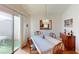 Inviting dining room with modern lighting, and a sliding door to the exterior at 5449 Bugle Way # 102, Las Vegas, NV 89108