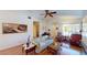 Bright living room featuring hardwood floors, comfortable seating, natural light, and artistic decorations at 5449 Bugle Way # 102, Las Vegas, NV 89108