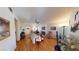 Spacious living room featuring hardwood floors, fireplace, comfortable seating, and unique musical décor at 5449 Bugle Way # 102, Las Vegas, NV 89108