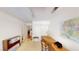 Bright office space with a large desk, closet, and neutral carpet at 5449 Bugle Way # 102, Las Vegas, NV 89108