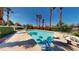 Beautiful community pool surrounded by lush landscaping and comfortable seating at 5449 Bugle Way # 102, Las Vegas, NV 89108