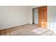 A well-lit bedroom features a closet with sliding wood doors and neutral carpeting at 5505 Indian Hills Ave, Las Vegas, NV 89130