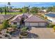 Beautiful home featuring a three-car garage, desert landscaping, and tile roof at 5505 Indian Hills Ave, Las Vegas, NV 89130