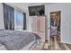Bright bedroom with closet and window, offering a comfortable space for relaxation at 5731 Kona Mountain St, North Las Vegas, NV 89031