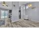 Open dining area next to the kitchen, featuring tile floors and modern decor at 5731 Kona Mountain St, North Las Vegas, NV 89031