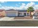 Charming single-story home featuring a tile roof, desert landscaping, and solar panels at 5731 Kona Mountain St, North Las Vegas, NV 89031