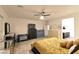 Bedroom features ceiling fan, dresser, and closet at 7097 Range Valley St, North Las Vegas, NV 89084