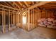 Spacious unfinished basement, featuring exposed framing, insulation, and potential for a customized living space at 714 Lacy Ln, Las Vegas, NV 89107