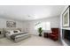 Light filled bedroom with a large bed, recessed lighting, modern art, and light colored wood floors at 714 Lacy Ln, Las Vegas, NV 89107