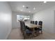 Spacious dining room featuring a rustic table with seating for eight under recessed lighting and a large window at 714 Lacy Ln, Las Vegas, NV 89107