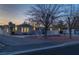 Exterior view of the house with a well-maintained yard at dusk at 714 Lacy Ln, Las Vegas, NV 89107