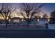 Exterior view of the house with a well-maintained yard at dusk at 714 Lacy Ln, Las Vegas, NV 89107
