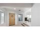 Elegant foyer with a stylish front door, bright lighting, and a glimpse into the living spaces at 714 Lacy Ln, Las Vegas, NV 89107