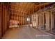 Unfinished interior reveals wooden beams and unfinished walls, ready for renovation at 714 Lacy Ln, Las Vegas, NV 89107
