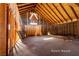 Unfinished interior shows framing, exposed beams, and a plywood wall at 714 Lacy Ln, Las Vegas, NV 89107