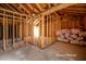 Bright room reveals wood framework, beams, and wall with potential for renovations at 714 Lacy Ln, Las Vegas, NV 89107