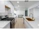 Modern kitchen showcasing stainless steel gas range and white countertops at 714 Lacy Ln, Las Vegas, NV 89107