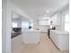 Spacious open kitchen featuring an island, modern stainless steel appliances, and white cabinets at 714 Lacy Ln, Las Vegas, NV 89107