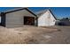 Rear exterior view of a home with a large outbuilding for storage at 714 Lacy Ln, Las Vegas, NV 89107