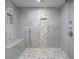 Modern shower with tile accents, a built-in bench, and dual showerheads at 714 Lacy Ln, Las Vegas, NV 89107