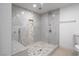 Modern shower with tile accents, a built-in bench, and dual showerheads at 714 Lacy Ln, Las Vegas, NV 89107