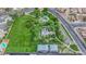 Aerial view of a community park with lush lawns, play structures, and walking paths at 7274 Pinebrook Cir, Las Vegas, NV 89147